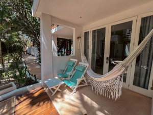 Swim up balcony with hammock and chairs at Cabanas Tulum Beach Hotel & Spa