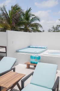 Private rooftop hot tub and loungers in Tulum hotel
