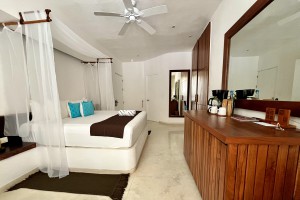 King size bed in beachfront room at Cabanas Tulum Beach Hotel & Spa