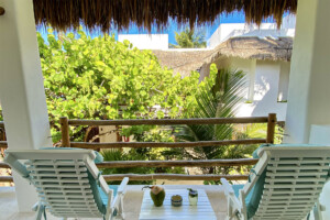 Balcony with chairs in a Sunset room at Cabanas Tulum Beach Hotel & Spa
